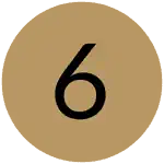 A black number 6 centered on a gold circular background.